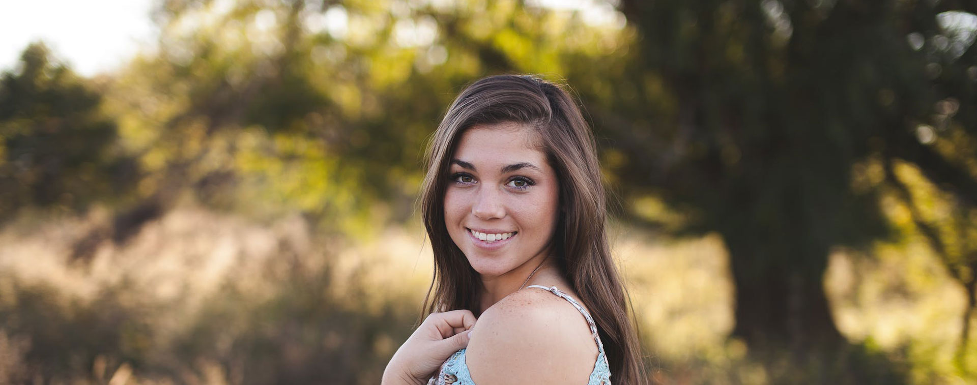 Girl smiling in a field
