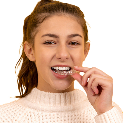 Young woman removing her clear aligners