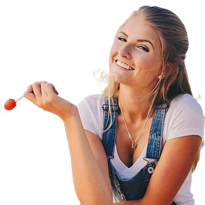 Young girl enjoying food while her clear aligners are removed
