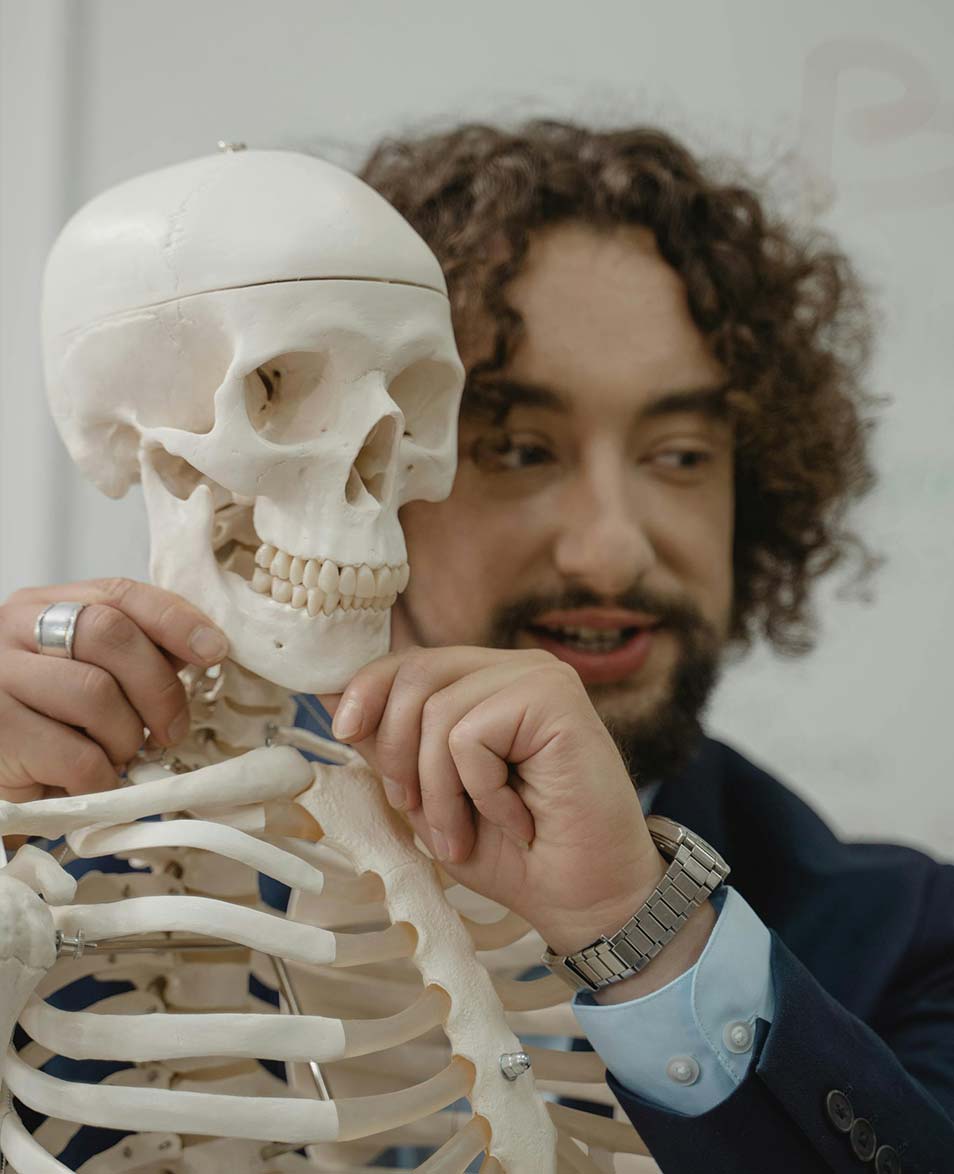 Child smiling with his father, representing confident development through early orthodontic care
