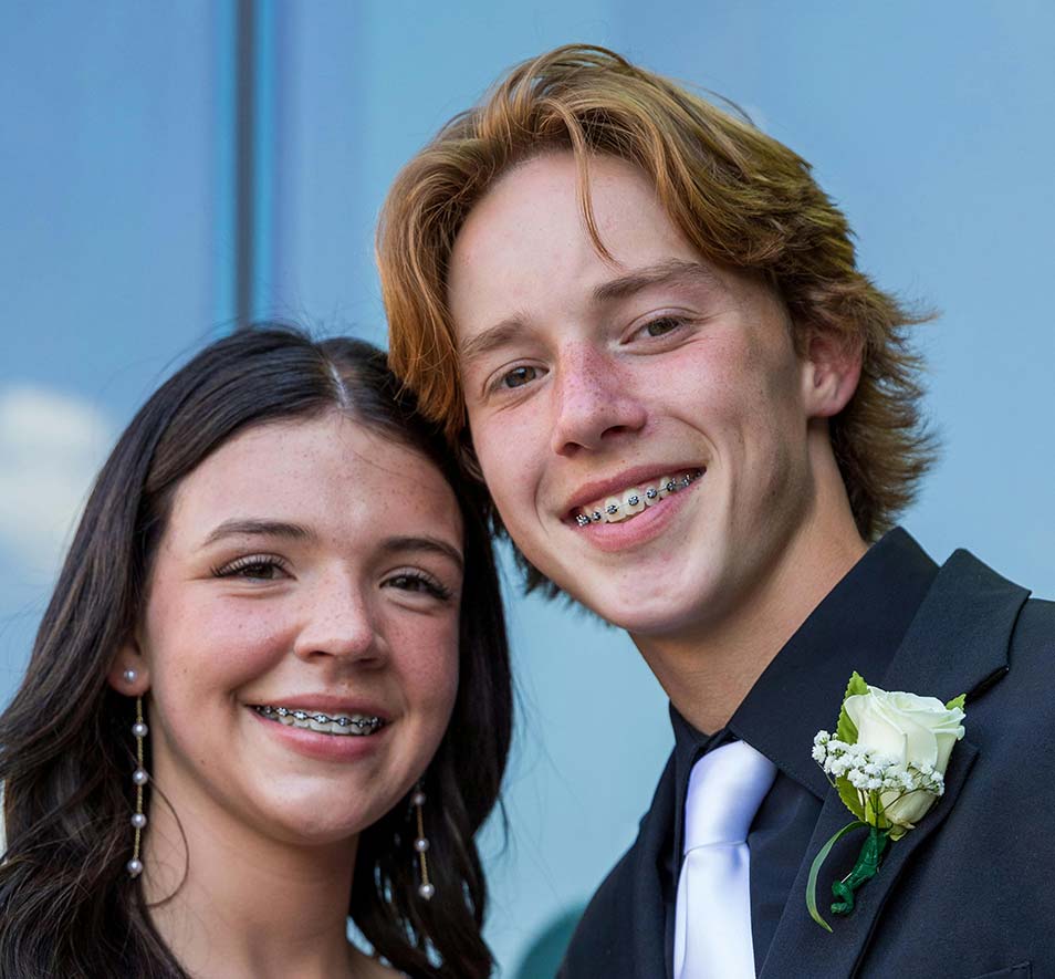 Young couple going out wearing meatal braces